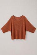 Sweater terracota de mujer con tejido calado, lurex plateado y manga semi murciélago